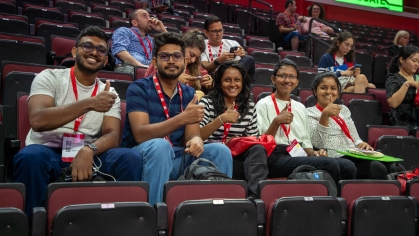 Five students in the arena for International Student Orientation